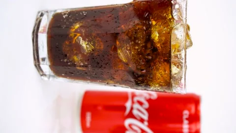 Glass of cold refreshing coca cola soda with ice, metal can of coca-cola classic Stock Footage 138019274