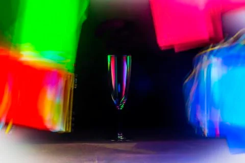 Glass with colored lights background Stock Photos