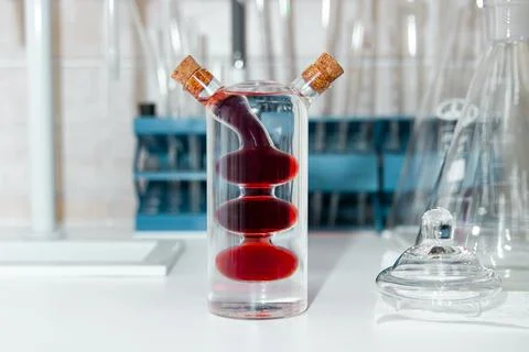 Glass combination container designed for mixing multi-colored liquids Stock Photos