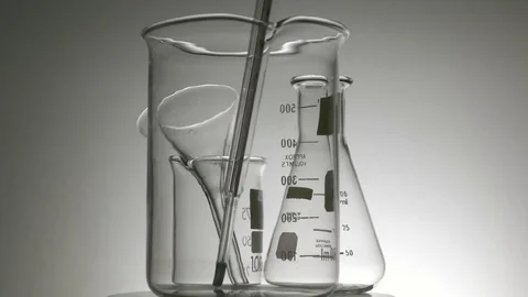 Glass containers rotating with backlighting Stock Footage 81967282