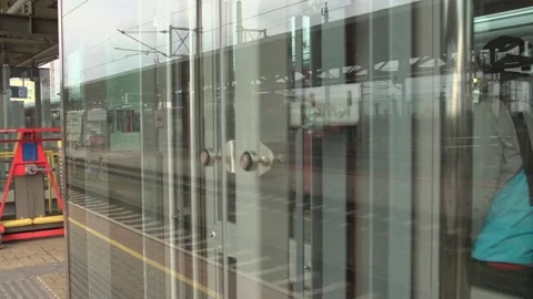 Glass covered elevator at train station platform Stock Footage 269837124