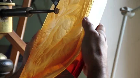 Glass craftsman working and creating designs at Moder glass factory Stock Footage 62231982