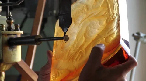 Glass craftsman working and creating designs at Moder glass factory Stock Footage 62232753