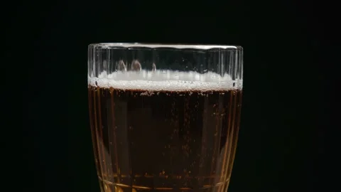 Glass cup with beer on black background Stock Footage 145248535
