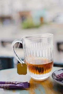 Glass Cup of Tea Almost Empty Standing on a Table Stock Photos