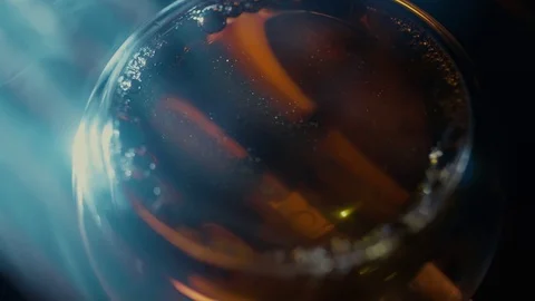 A glass cup with tea in different lighting from above. Stock Footage 116182709