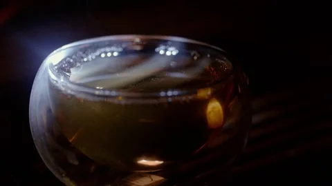 A glass cup with tea in different lighting. Stock Footage 116182721