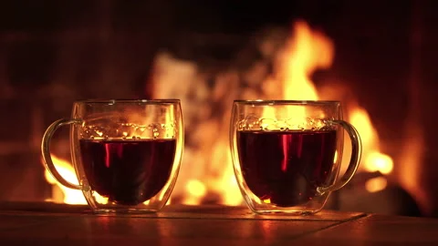 Glass cups with tea on the background of the fireplace Stock Footage 147327649