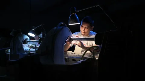 Glass Cutter Working in Workshop Under Focused Lamp Light Video stock 305455265