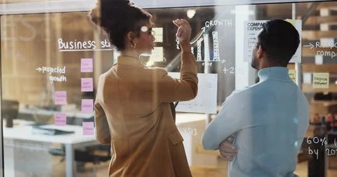 Glass, data analysis and team in office, discussion and planning for financial Stock Photos