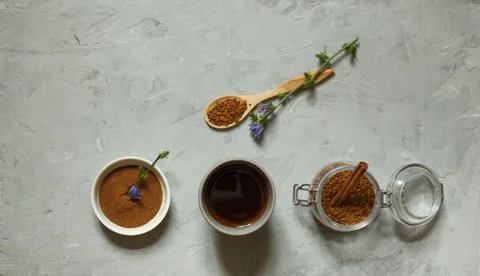 A glass of decaffeinated coffee from chicory root, ground powder and pellets Stock Photos