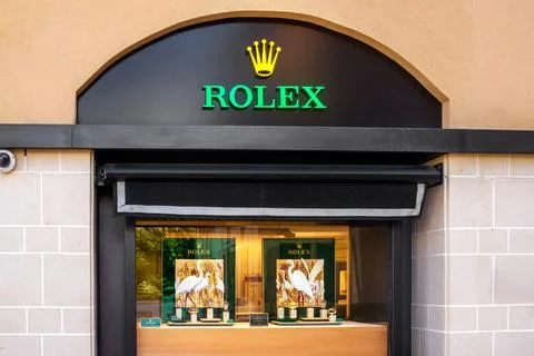 Glass Display Window With Graphics And Watches Of The Rolex Brand Stock Photos