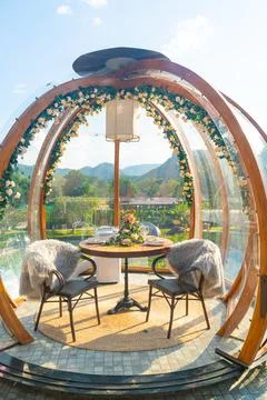 Glass dome with dining table Stock Photos