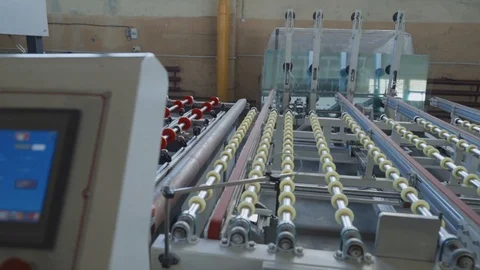 Glass for double glazed windows moves on the machine Stock Footage 102337261