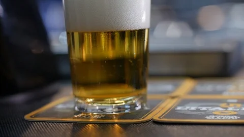 A glass of draft beer pan Stock Footage 119595613