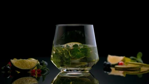 Glass with drink and fruit on background Stock Footage 125256268