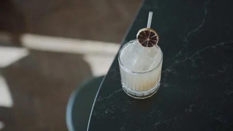 A glass of drink with a lime slice on top Stock Footage 295993849
