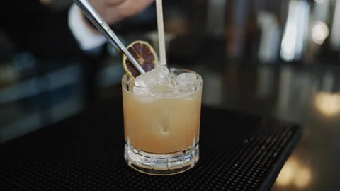 A glass of drink with a lime slice on top Stock Footage 295993933