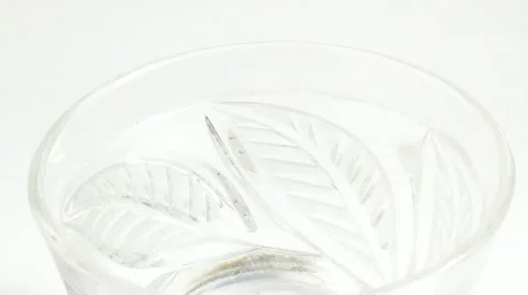 In a glass of drink throwing ice cubes Stock-Footage 69024339