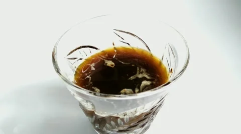 In a glass of drink throwing ice cubes Stock-Footage 69024354