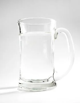 Glass of drinking water, studio background with lights and shadows. concept of Stock Photos
