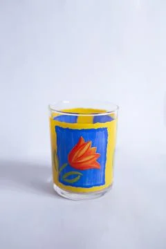 Glass for drinks with patterns of flowers Stock Photos