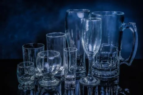 Glass drinkwares and stemwares of different shapes and sizes Stock Photos