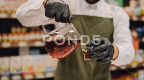 Glass dripper with brewed tea close-up. Tea tasting with a dripper and kettle Stock Photos