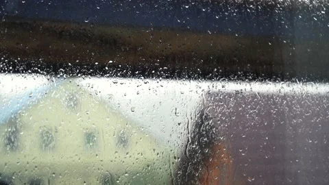 Glass in drops of rain going outside the window Stockbeeldmateriaal 161826952