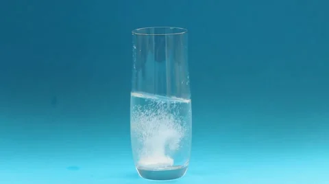 A glass with an effervescent tablet Stock Footage 67712010