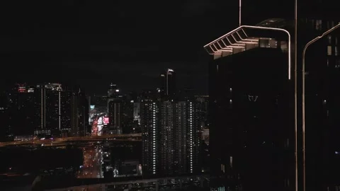 Glass Elevator Ascending Skyscraper in Bangkok, Thailand at Night Video stock 333599144