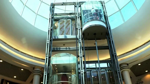 Glass elevator in large mall Stock Footage 104906699
