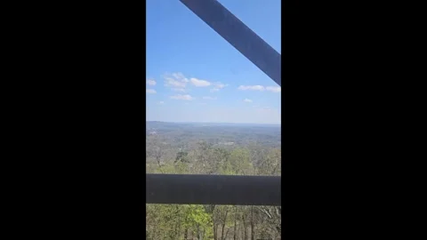 Glass Elevator Ride in a Tower High Above the Mountains Video stock 332742866
