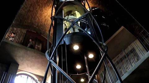 Glass elevator rides with tourists inside the Old Town Hall Tower Stock Footage 64483805
