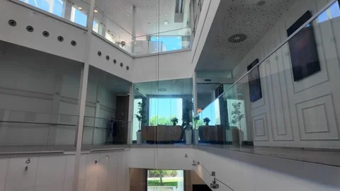 Glass Elevator Traveling Inside Modern Office Building Atrium, Interior View Stock Footage 343322522