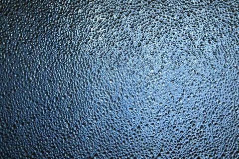 Glass with embossed wave pattern. Glass blue. Stock Photos