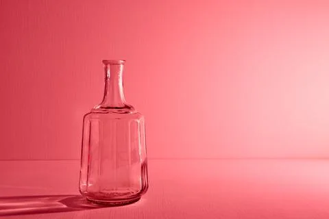 Glass empty open bottle with copy space. Graphic still life concept Stock Photos