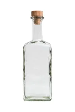 Glass empty square bottle on isolated background. Foto stock