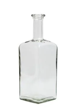 Glass empty square bottle on isolated background. Stock Photos
