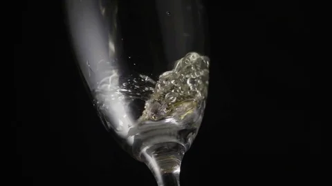 Glass with engagement ring super slow mo Stock Footage 72561144
