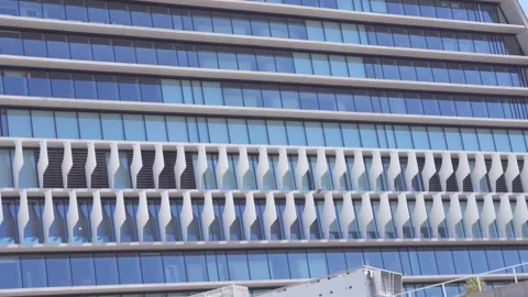 Glass facade of a contemporary skyscraper Video stock 336558654