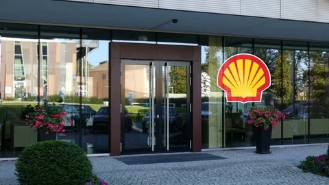 Glass facade of a modern office building with Shell Oil Company logo. Editorial Stock Footage