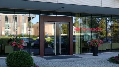Glass facade of a modern office building with Santander Serfin logo. Editorial Stock Footage 80662893