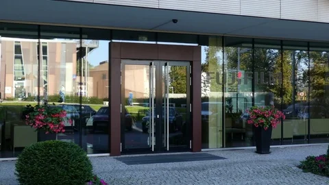 Glass facade of a modern office building with Fujifilm logo. Editorial 3D Video stock 80666541