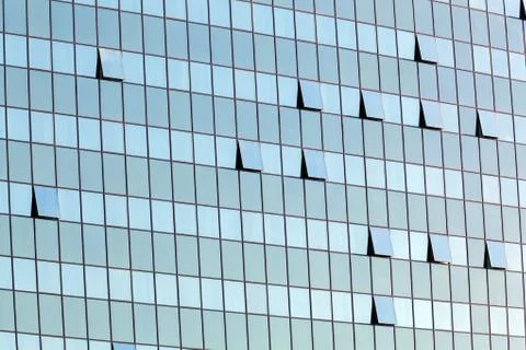 Glass facade with opened windows Stock Photos
