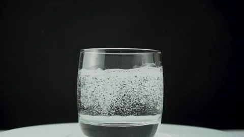 A glass filled with water with bubbles Stock Footage 125866900