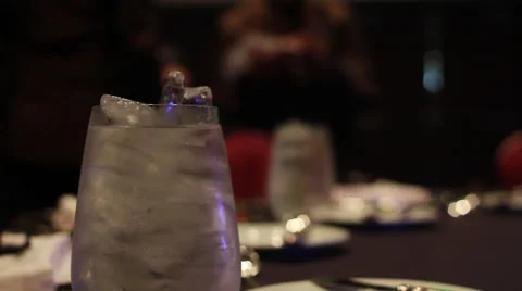 Glass Filled With Water on Table, Filled to brim (Shallow DOF) Stock Footage 58337271