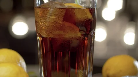 Glass of fizzy drink on the table Stock Footage 125336947