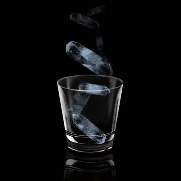 A glass with floating ice cube on a dark environment, low key light photogr.. Stock Photos