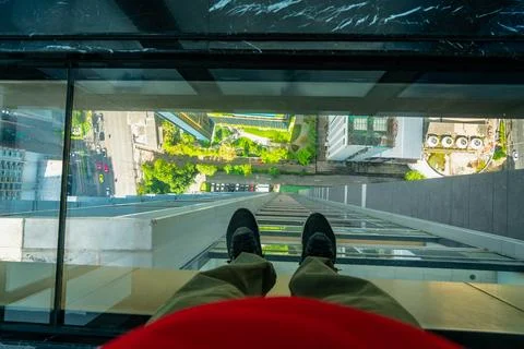 Glass floor looking down from high rise Stock Photos